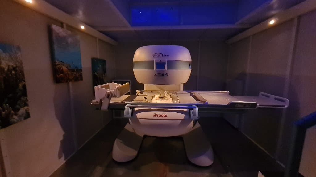 Calm patient in modern open MRI suite at Cayman Boutique Clinic